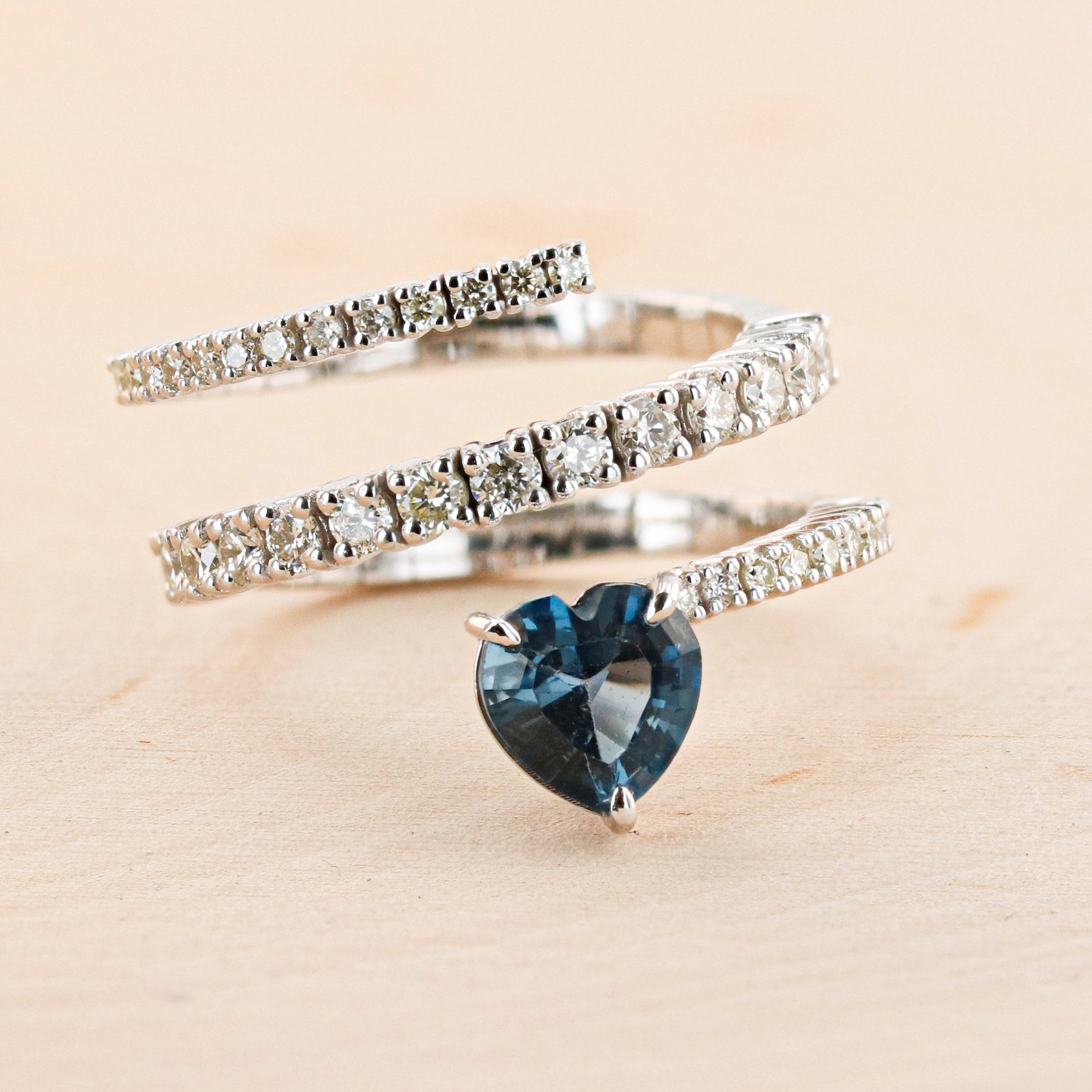 BLUE TOPAZ AND DIAMOND SWIRL RING