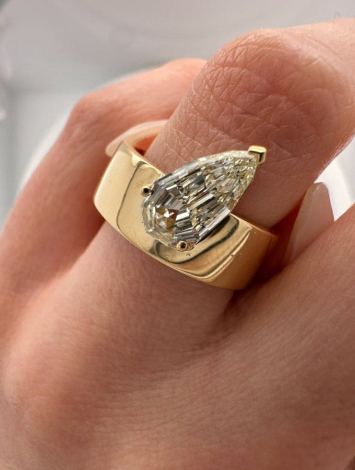 1.20 CARAT STEP CUT PEAR ON CIGAR BAND