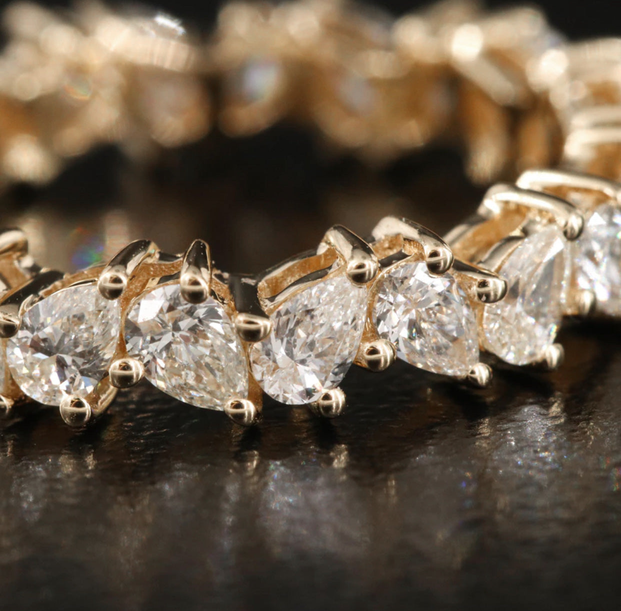 CROOKED STYLE PEAR ETERNITY BAND