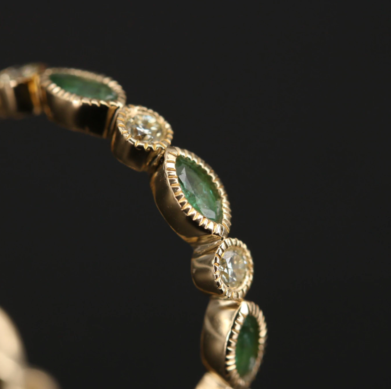DIAMOND AND EMERALD SCALLOPED ETERNITY BAND