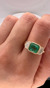 COLOMBIAN EMERALD AND CADILLAC DIAMOND BEZEL RING