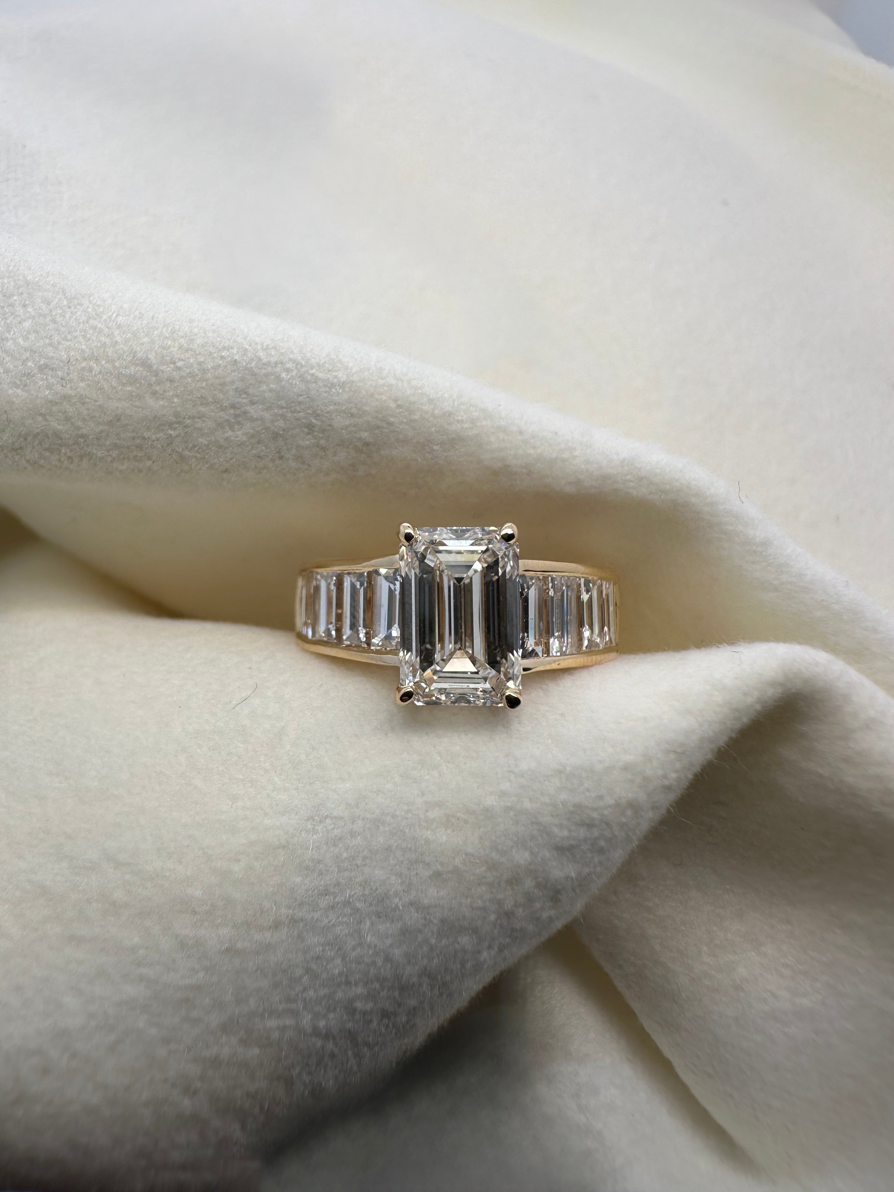 EMERALD CUT AND BAGUETTE CHANNEL DIAMOND RING