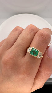 COLOMBIAN EMERALD AND CADILLAC DIAMOND BEZEL RING