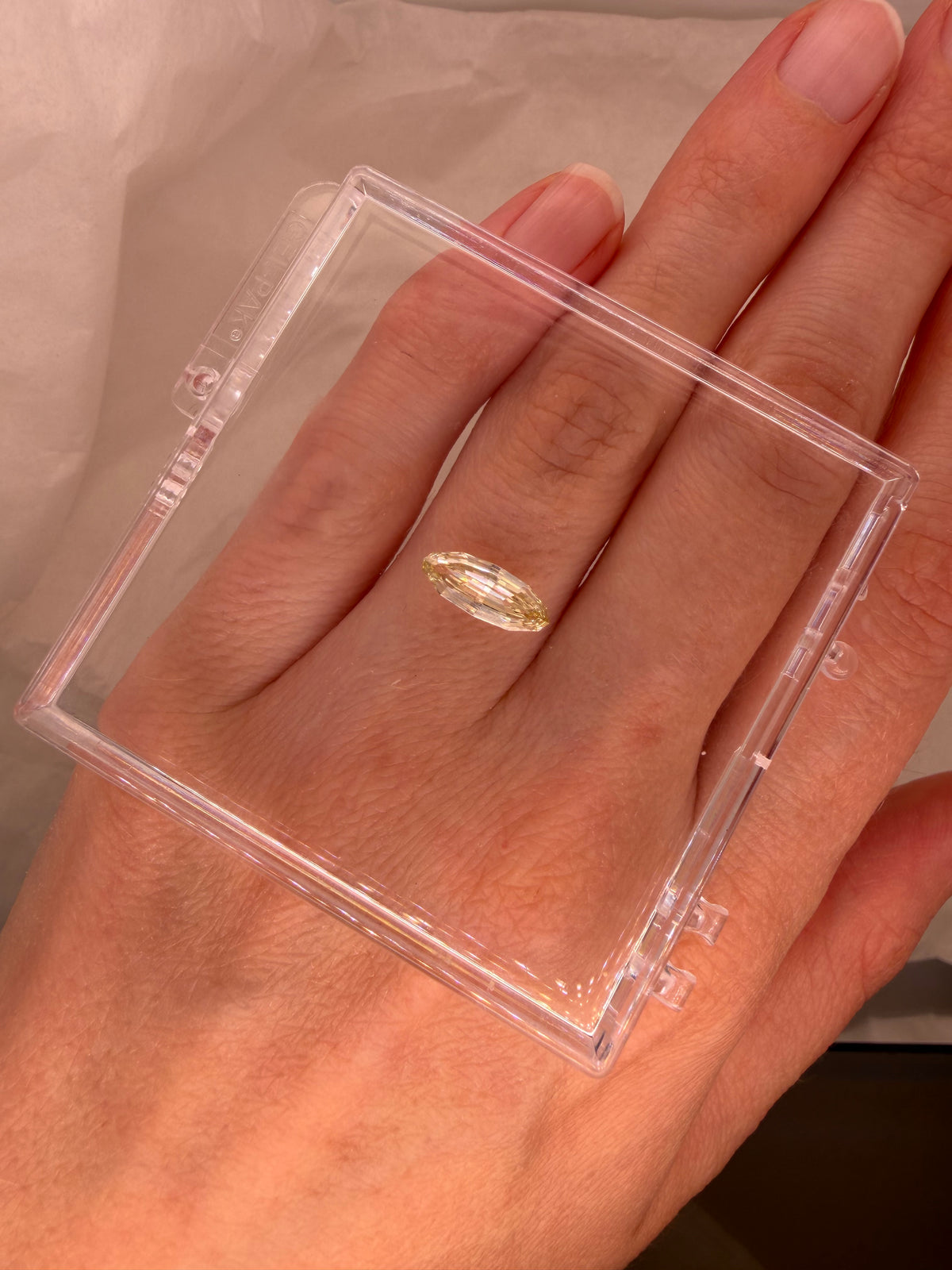 1.09 CARAT BUTTER YELLOW STEP CUT MOVAL