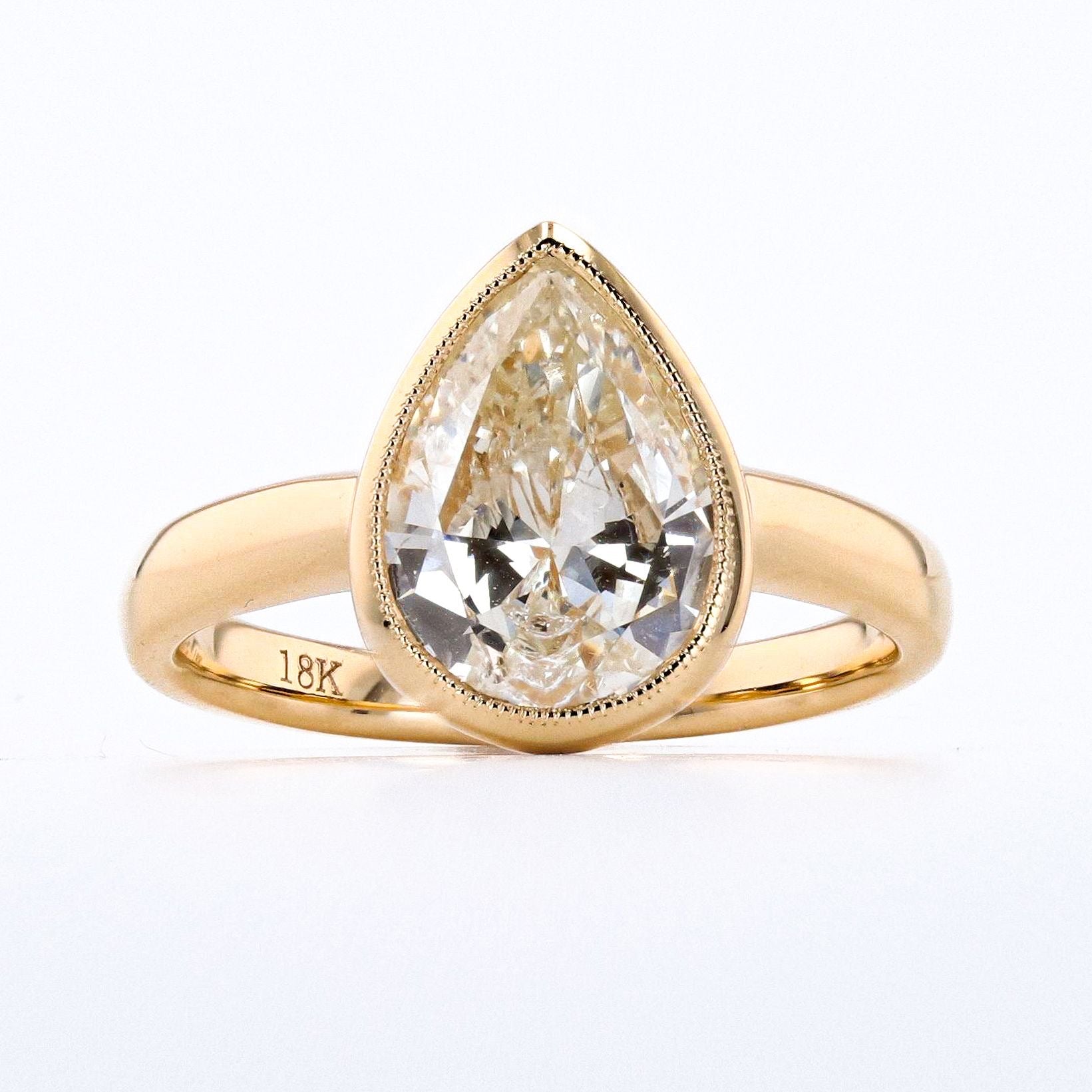 2.02 CARAT PEAR SHAPE DIAMOND BEZEL RING