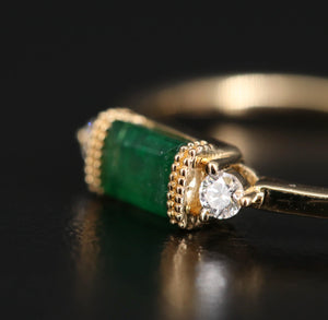 BAGUETTE EMERALD AND DIAMOND RING